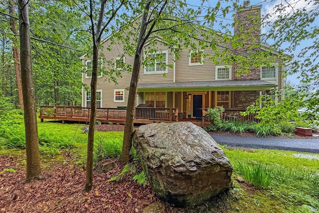 1218 Clymer Ln, Pocono Pines, PA 18350 - view of front of house featuring a chimney and a porch
