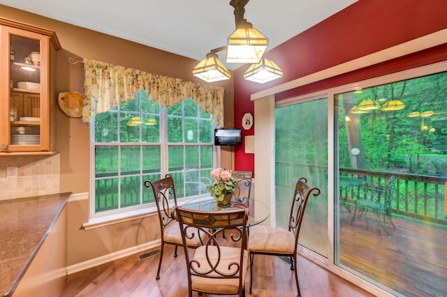 1218 Clymer Ln, Pocono Pines, PA 18350 - dining room featuring wood finished floors and plenty of natural light