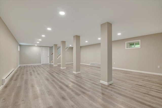 7 Eagle Ct, Lake Ariel, PA 18436 - below grade area with a baseboard radiator, light wood-style floors, baseboards, stairway, and recessed lighting