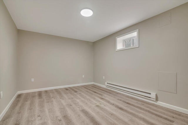7 Eagle Ct, Lake Ariel, PA 18436 - empty room featuring a baseboard radiator, light wood-style floors, and baseboards
