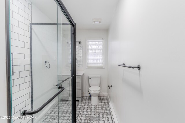 3011 Minqua Cir, Tobyhanna, PA 18466 - full bath featuring a stall shower, toilet, baseboards, and tile patterned floors