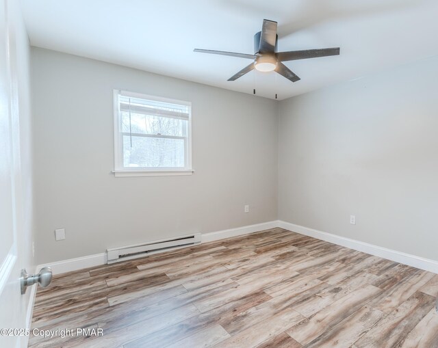 3011 Minqua Cir, Tobyhanna, PA 18466 - unfurnished room featuring baseboard heating, wood finished floors, ceiling fan, and baseboards