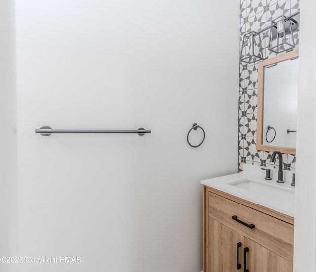 bathroom with vanity and backsplash