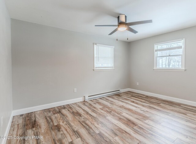 3011 Minqua Cir, Tobyhanna, PA 18466 - spare room with a baseboard heating unit, plenty of natural light, wood finished floors, and ceiling fan