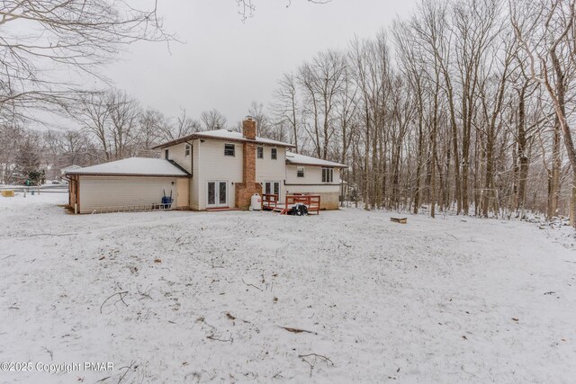 3011 Minqua Cir, Tobyhanna, PA 18466 - view of snowy exterior with a chimney and french doors