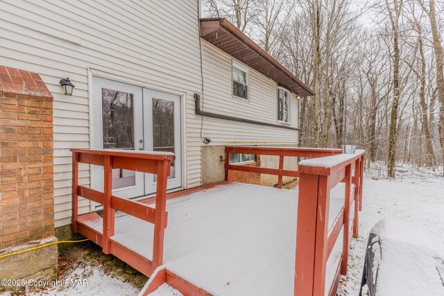 view of snow covered deck