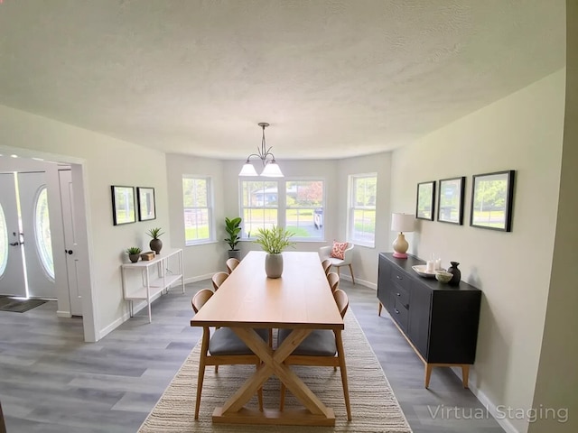 130 Sugar Hill Rd, Saylorsburg, PA 18353 - dining space featuring baseboards, wood finished floors, and a chandelier