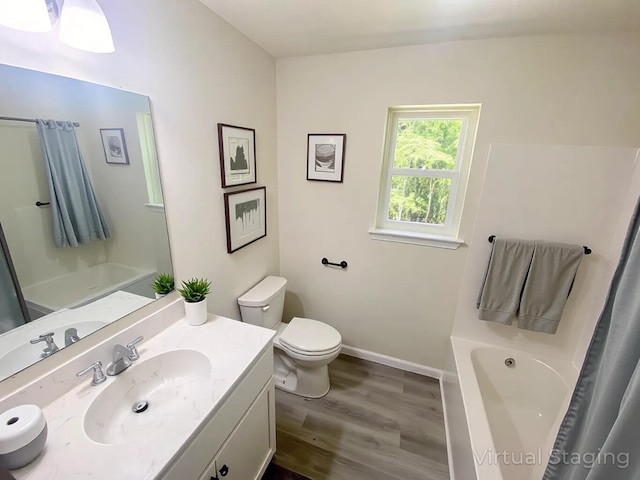 130 Sugar Hill Rd, Saylorsburg, PA 18353 - full bathroom with toilet, wood finished floors, vanity, and baseboards
