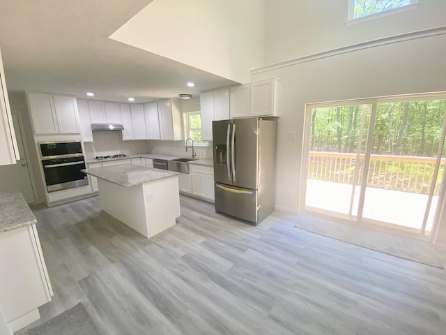 130 Sugar Hill Rd, Saylorsburg, PA 18353 - kitchen featuring appliances with stainless steel finishes, under cabinet range hood, a sink, white cabinets, and recessed lighting
