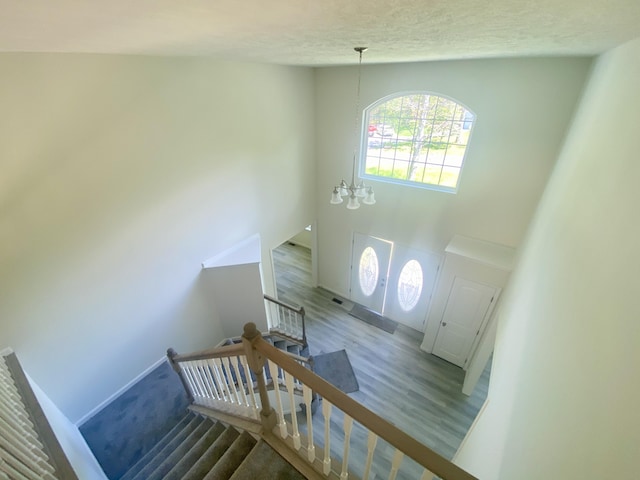 130 Sugar Hill Rd, Saylorsburg, PA 18353 - stairs with wood finished floors, a textured ceiling, and baseboards