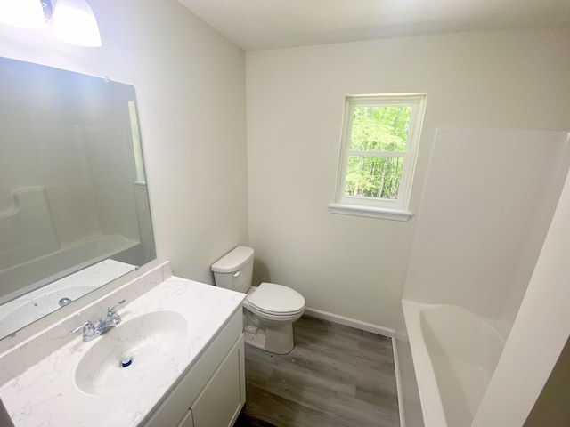 130 Sugar Hill Rd, Saylorsburg, PA 18353 - full bathroom featuring wood finished floors, toilet, vanity, and baseboards