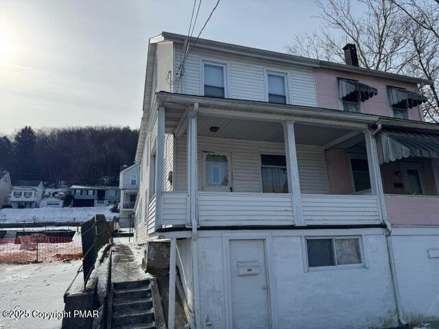 view of side of property featuring a chimney