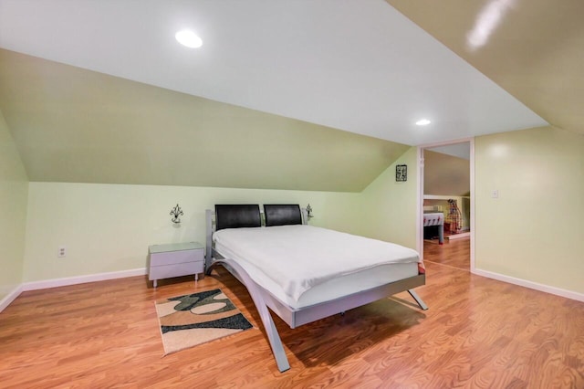 295 Wyomissing Dr, Pocono Lake, PA 18347 - bedroom with vaulted ceiling, wood finished floors, and recessed lighting
