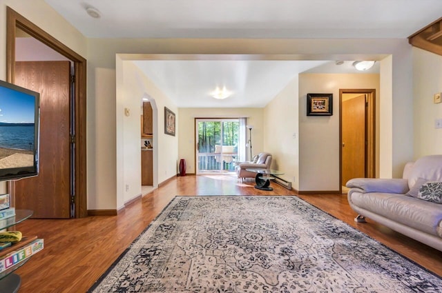 295 Wyomissing Dr, Pocono Lake, PA 18347 - living area with wood finished floors and a baseboard radiator