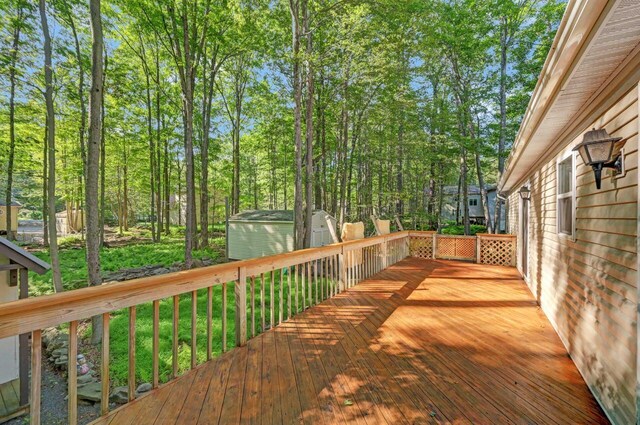 295 Wyomissing Dr, Pocono Lake, PA 18347 - wooden deck featuring a storage shed