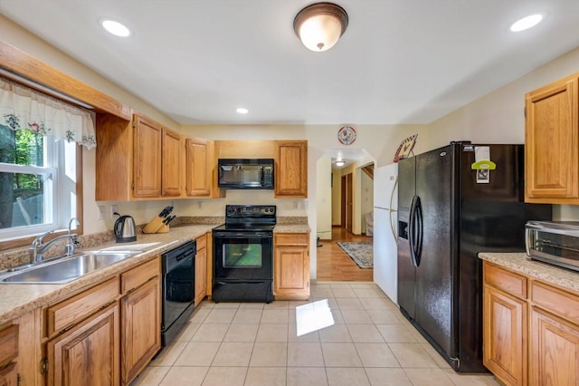 295 Wyomissing Dr, Pocono Lake, PA 18347 - kitchen with black appliances, light countertops, light tile patterned floors, and recessed lighting