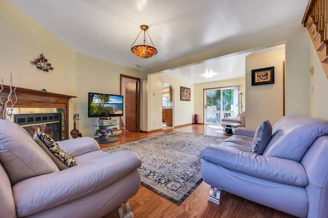 295 Wyomissing Dr, Pocono Lake, PA 18347 - living room featuring wood finished floors and a glass covered fireplace