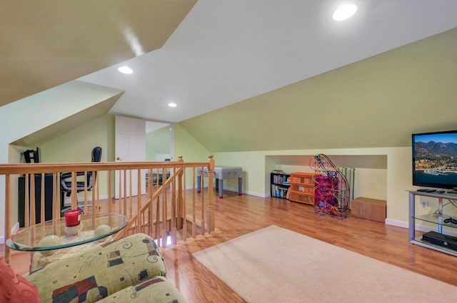 295 Wyomissing Dr, Pocono Lake, PA 18347 - sitting room with an upstairs landing, wood finished floors, vaulted ceiling, and recessed lighting