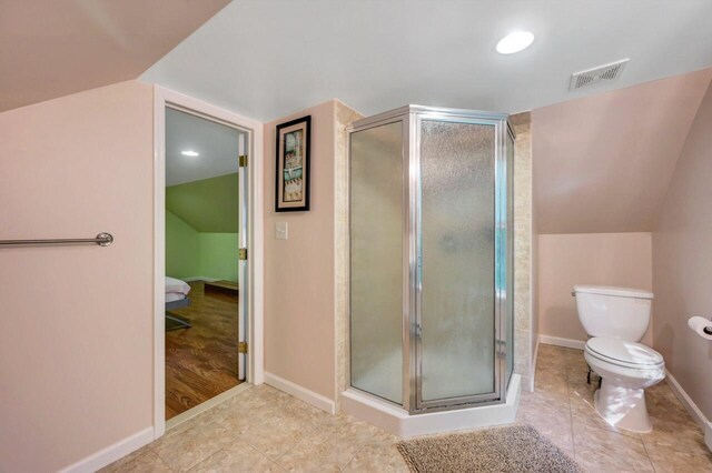 295 Wyomissing Dr, Pocono Lake, PA 18347 - bathroom with vaulted ceiling, a stall shower, and tile patterned floors