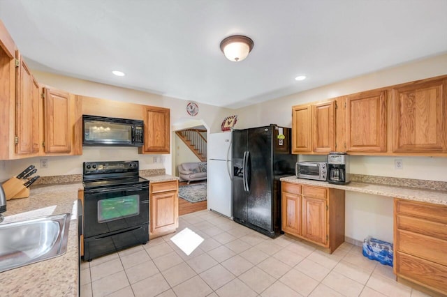 295 Wyomissing Dr, Pocono Lake, PA 18347 - kitchen with black appliances, light countertops, light tile patterned floors, and recessed lighting