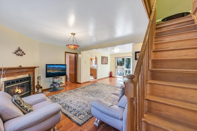 295 Wyomissing Dr, Pocono Lake, PA 18347 - living area with stairway, wood finished floors, and a fireplace
