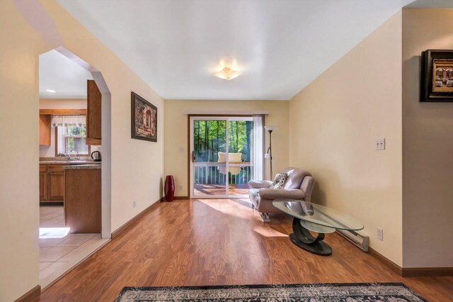 295 Wyomissing Dr, Pocono Lake, PA 18347 - living area featuring light wood finished floors and arched walkways