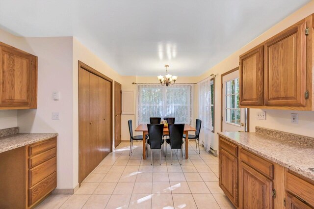 295 Wyomissing Dr, Pocono Lake, PA 18347 - dining space with a chandelier and light tile patterned flooring