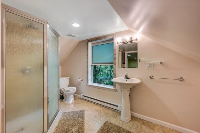 295 Wyomissing Dr, Pocono Lake, PA 18347 - full bathroom featuring a baseboard heating unit, vaulted ceiling, a stall shower, and tile patterned floors