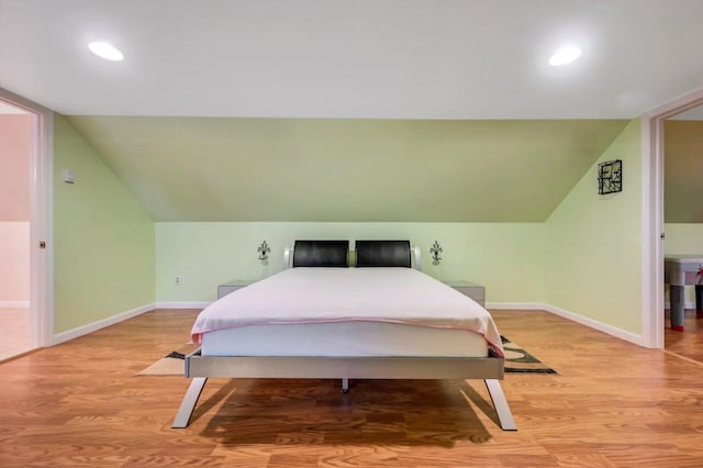 295 Wyomissing Dr, Pocono Lake, PA 18347 - bedroom featuring light wood finished floors, vaulted ceiling, and recessed lighting