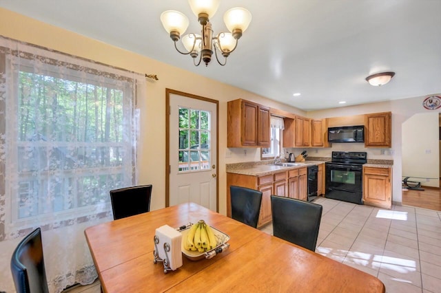 295 Wyomissing Dr, Pocono Lake, PA 18347 - dining space with a chandelier and light tile patterned flooring