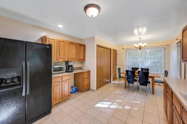 295 Wyomissing Dr, Pocono Lake, PA 18347 - kitchen with black fridge with ice dispenser, a chandelier, light countertops, light tile patterned floors, and recessed lighting