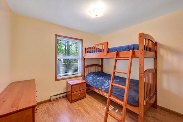 295 Wyomissing Dr, Pocono Lake, PA 18347 - bedroom featuring a baseboard radiator and light wood-type flooring