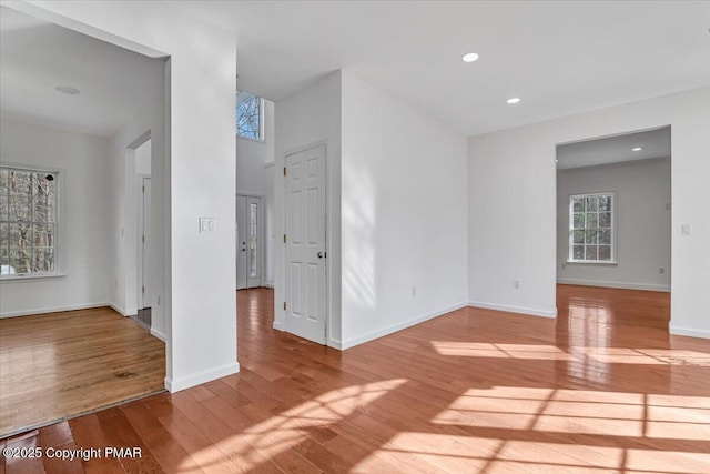 empty room with light hardwood / wood-style floors