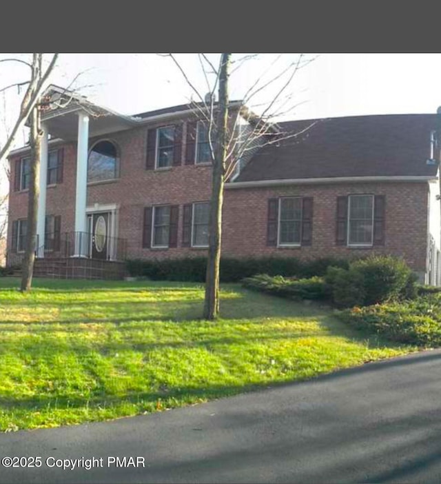 view of front of home with a front yard