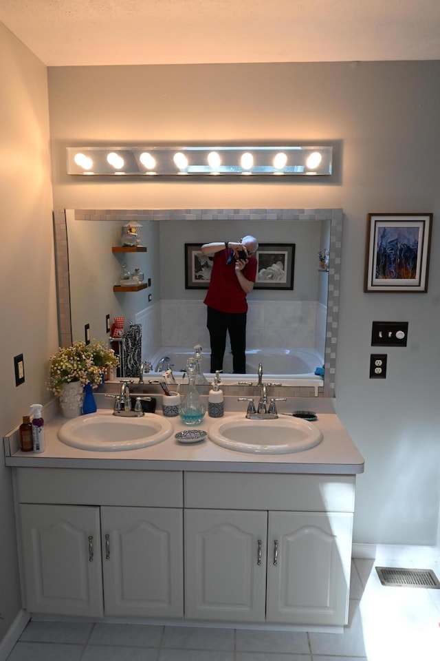 1617 Academy Dr, East Stroudsburg, PA 18301 - bathroom with tile patterned flooring, a bathtub, and double vanity