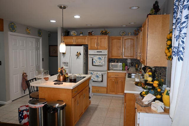 1617 Academy Dr, East Stroudsburg, PA 18301 - kitchen featuring white appliances, light tile patterned floors, light countertops, backsplash, and a kitchen island