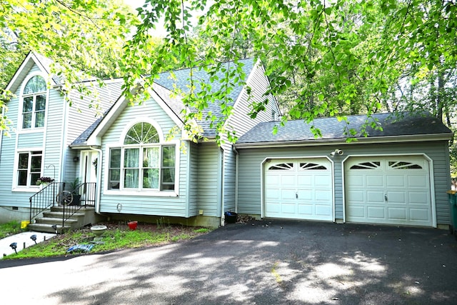 1617 Academy Dr, East Stroudsburg, PA 18301 - view of front of house featuring driveway, a garage, and roof with shingles