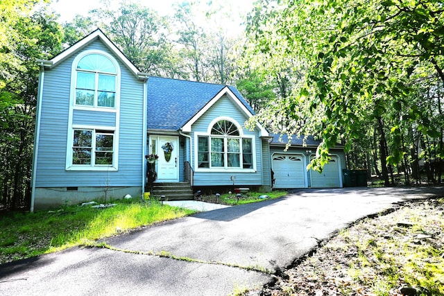 1617 Academy Dr, East Stroudsburg, PA 18301 - traditional home featuring driveway, crawl space, entry steps, a garage, and a shingled roof