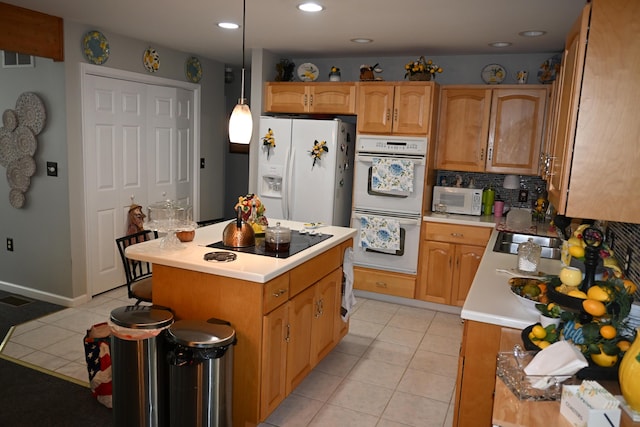 1617 Academy Dr, East Stroudsburg, PA 18301 - kitchen featuring white appliances, light tile patterned flooring, light countertops, backsplash, and a center island
