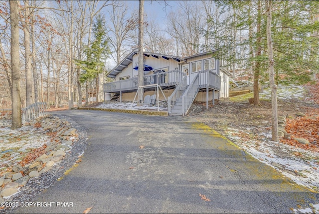 3126 Snowden Dr, Bushkill, PA 18324 - chalet / cabin with stairway and a wooden deck