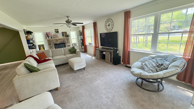 2292 Bismark Rd, Blakeslee, PA 18610 - living area with carpet, a ceiling fan, a fireplace, and baseboards