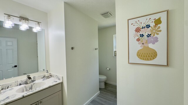 2292 Bismark Rd, Blakeslee, PA 18610 - bathroom featuring wood finished floors, vanity, toilet, and baseboards