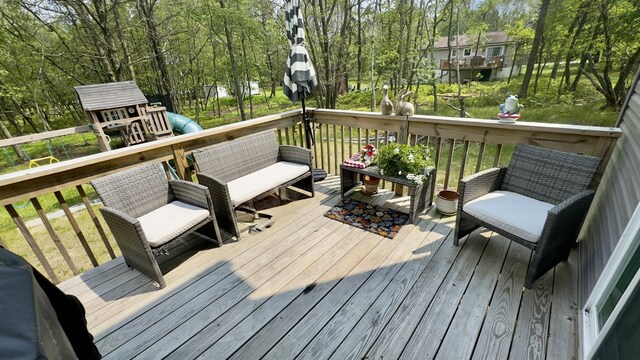 2292 Bismark Rd, Blakeslee, PA 18610 - deck with view of wooded area and a playground