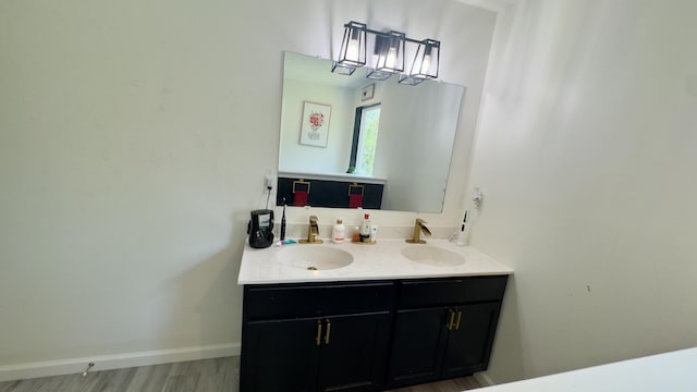 2292 Bismark Rd, Blakeslee, PA 18610 - bathroom featuring double vanity, wood finished floors, and baseboards