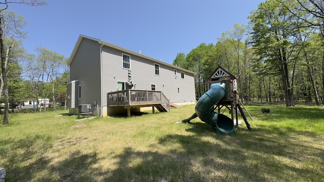2292 Bismark Rd, Blakeslee, PA 18610 - back of property featuring a yard, a playground, a deck, and central AC unit