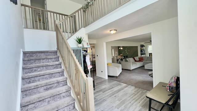 2292 Bismark Rd, Blakeslee, PA 18610 - stairway featuring wood finished floors, a ceiling fan, and baseboards