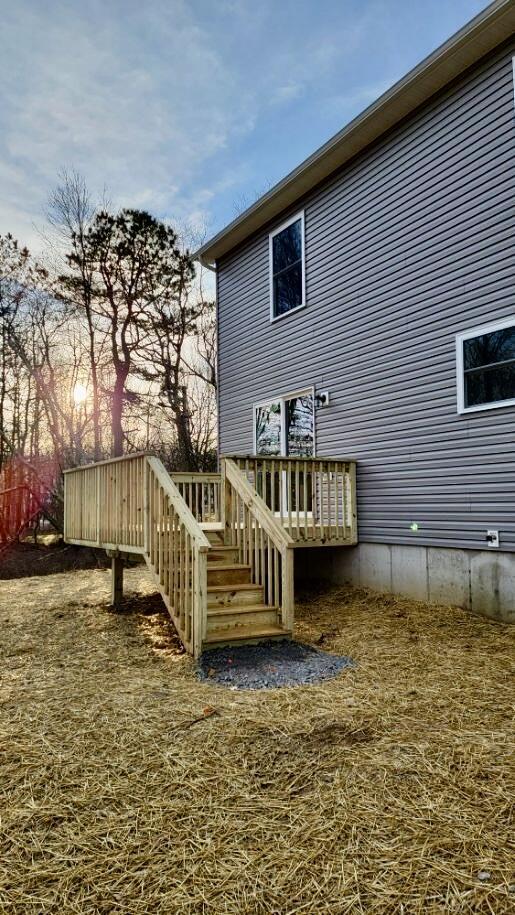 2292 Bismark Rd, Blakeslee, PA 18610 - back of property with a wooden deck and stairway