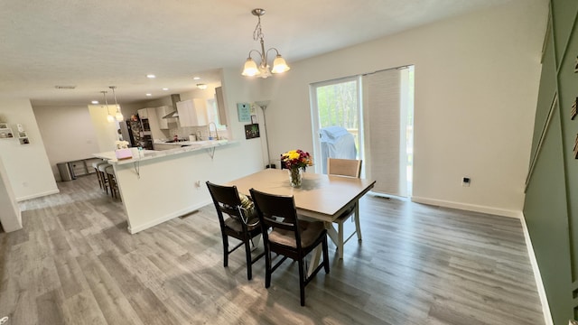 2292 Bismark Rd, Blakeslee, PA 18610 - dining space featuring light wood-style flooring, recessed lighting, baseboards, and a chandelier