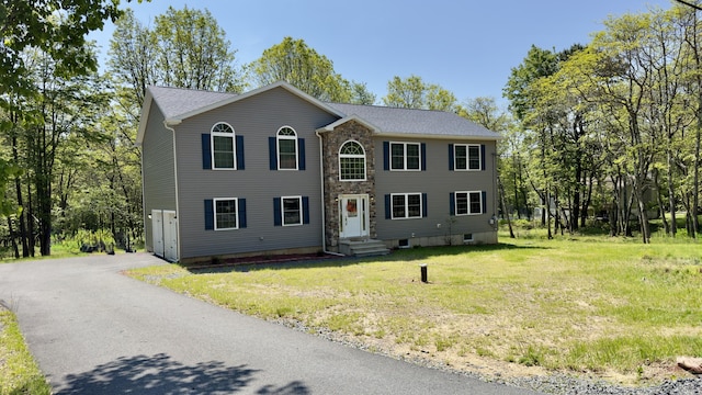 2292 Bismark Rd, Blakeslee, PA 18610 - colonial-style house with asphalt driveway, stone siding, and a front yard