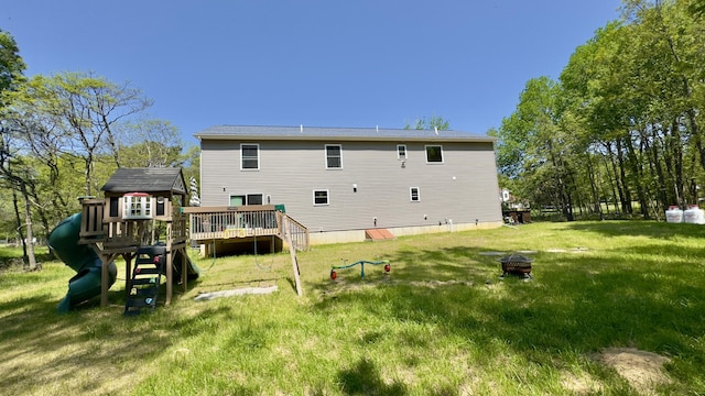 2292 Bismark Rd, Blakeslee, PA 18610 - back of house featuring an outdoor fire pit, a yard, a playground, and a deck